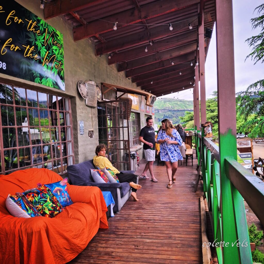 A peaceful outdoor chill zone with comfortable seating, offering a perfect view of the Maluti Mountains for visitors to relax.